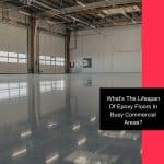 a warehouse with shiny epoxy flooring indicating a good epoxy floor lifespan