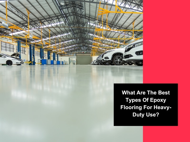 A workshop floor showcasing different types of epoxy flooring, including metallic, flake, and solid colour finishes.