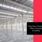 A large warehouse with an open layout, showcasing the importance of floor thickness in industrial settings.