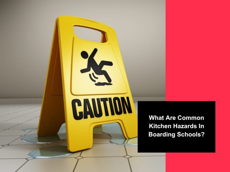 Yellow caution sign on a wet floor highlighting kitchen hazards like slips and falls in boarding school kitchens.