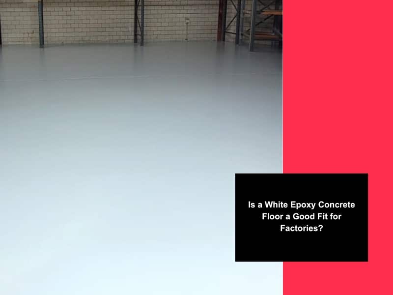 Empty warehouse with seamless white epoxy concrete floor surface ready for industrial or factory use.