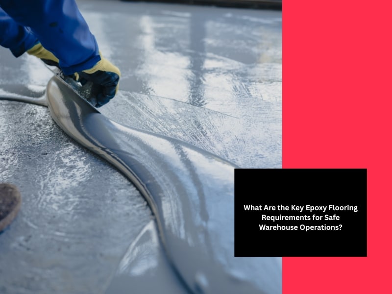 Worker spreading coating during epoxy floor application using trowel on wet surface.